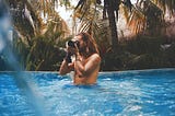 6 Common Mistakes to Avoid as a First-Time Digital Nomad — man taking picture in pool