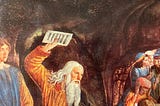 A person of ambiguous gender, with long hair and a dreamy expression, looks down on Moses about to throw the Ten Commandments at a bunch of golden calf-worshipping heathens.