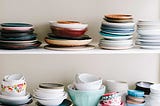 Dishes on a shelf.