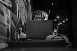 A man frowns while working on his laptop.