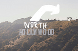 Hollywood sign with added graphic: North. And arrow that points over the hill.