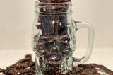 homemade black pepper jerky in a skull jar