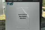 An AMD (Advanced Molecular Detection) Days poster that reads “Lunch Only for Non-Federal Attendees.”