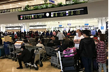 Travelers at Manila Ninoy Aquino International Airport anxiously await their flights home during the onset of the global Coronavirus pandemic. Photo by Brett Schmechel on March 17, 2020.