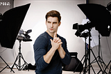 A picture of the an actor in a set with film equipment