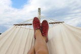 A man lying in a hammock, rising above the political turmoil that seems to be grabbing everyone by the throat. America. 2024 Election. Presidential Politics. Peace.