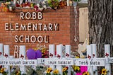 Front of Robb Elementary School in Uvalde, Texas with memorial crosses of the children and teachers massacred on May 24, 2022.