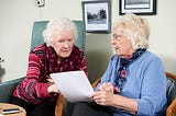 Photo of two residents having a conversation at a sheltered accomodation in Hassocks, West Sussex.
