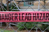 Danger Lead Hazard written on a pink label