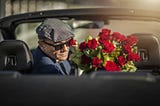 Man with flowers Stock Image.