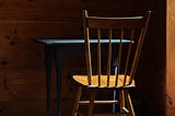A chair and desk in a barn