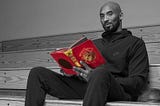 Kobe Bryant with his first book The Wizenard Series: Training Camp