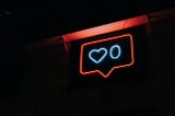 A sign with a social media heart/like button with a zero.