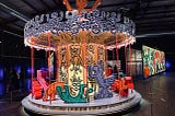 A carousel with figures by artist Keith Haring