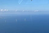 An aerial view of offshore wind turbines