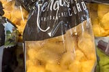 A plastic bag containing fresh and warm cheese curds from Reynard’s in Sturgeon Bay, Wisconsin
