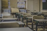 school classroom with desks and chairs