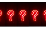 five red neon question marks