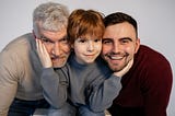 a child with his father and grandfather