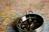 Image of a compass on a map