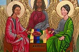 Icon painting of three robed, winged, haloed women of color surrounding rainbow communion table to depict the Holy Trinity