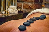 Chaotic Reflections From Woman on the Edge of a Hot Stone Massage Table