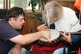 Patrick giving a banjo lesson at Camp Adventure 2010