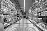 A supermarket aisle seen from the inside of a trolley