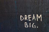 words “dream big.” written on a wall