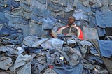Should we be placing restrictions on second-hand clothing imports or virgin textile production?