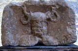 A stone bas-relief of a man with horns or antlers. Cernunnos as depicted on the Pillar of the Boatmen, circa first century CE.