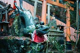 A diving brass fox figureine at a shrine in Kyoto
