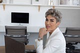 Helen Mohsenzadeh sitting at desk with laptop