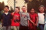 Pictured: Childhood friends from kindergarten. From left to right, I’m the fourth person, wearing a traditional Chinese qipao.