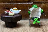 Crocodile reading a newspaper with tea on the table next to him
