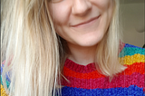 In a moment of lack of focus Hannah takes a selfie in her rainbow jumper.