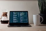 Coffee and computer with code