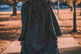 https://www.pexels.com/photo/woman-in-black-long-sleeve-dress-standing-on-brown-concrete-pathway-3186386/