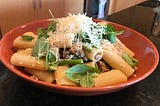 Rigatoni with sausage, spring vegetables and mustard