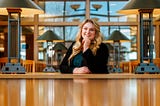 Delaney smiles for a photo in the Law Library