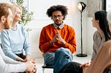 Group Attending a Meeting in a Bright Room