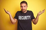 Man Shrugging Shoulders Wearing Security T-Shirt