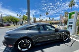 A nice grey car charges at an EV charging station in Palm Springs California