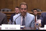 Photo of former Alabama football coach Nick Saban speaking at a name, image, and likeness (NIL) roundtable on athlete compensation in college sports on March 12, 2024 in Washington, DC