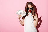 Women holding money because she learned about financial wealth