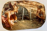 My sister and me, ages nine and six, looking at a giant tortoise in Kenya.