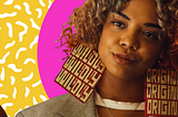 Tessa Thompson’s character “Detroit” wearing earrings that state “Wildly” on the left earring and “Original” on the right earring.