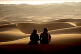 Chani (Zendaya) and Paul Atreides (Timothée Chalamet) out in the desert.