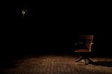 An empty chair in the dark