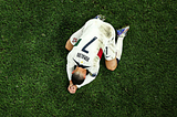 A view of Christiano Ronaldo sadly bowed on his face in defeat, shown from above
